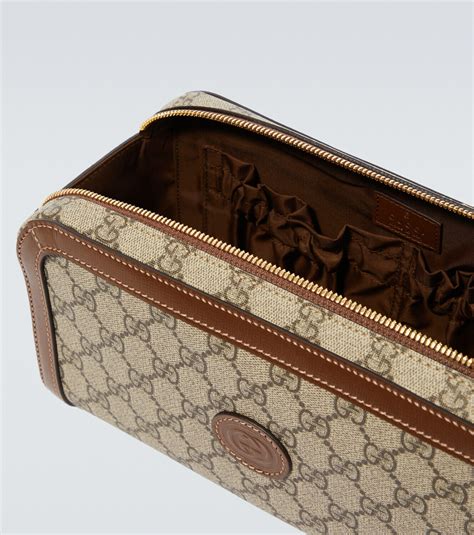 GG canvas toiletry bag in brown .